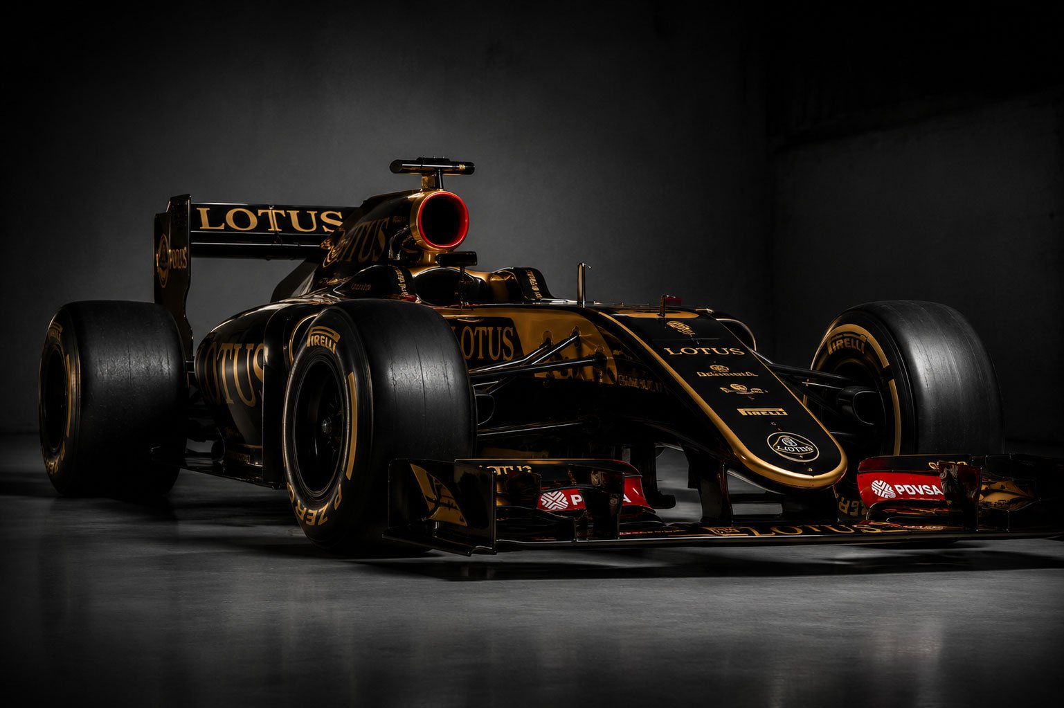 Lotus Formula One car in a dramatic night paddock